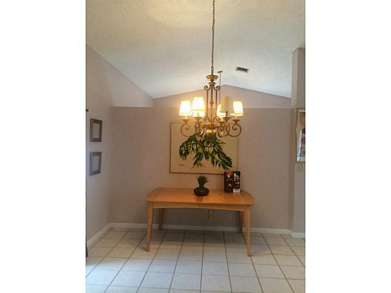 21080 Woodspring Avenue Boca Raton, FL 33428 - Photo 13 of 20 a room with lots of white furniture