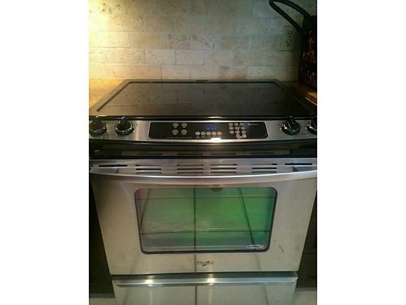 21080 Woodspring Avenue Boca Raton, FL 33428 - Photo 5 of 20 a close view of a stove top oven