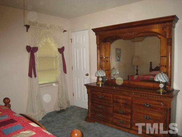 3712 Allen Street West Raleigh, NC 27603 - Photo 14 of 23 a living room with furniture and a mirror