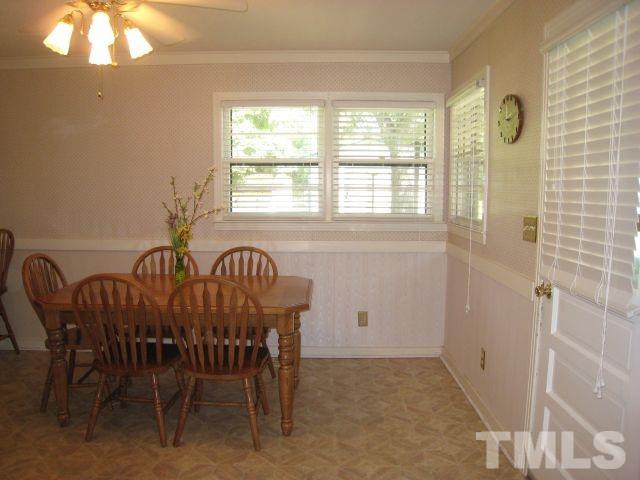 3712 Allen Street West Raleigh, NC 27603 - Photo 8 of 23 a view of a dining room with furniture and a window
