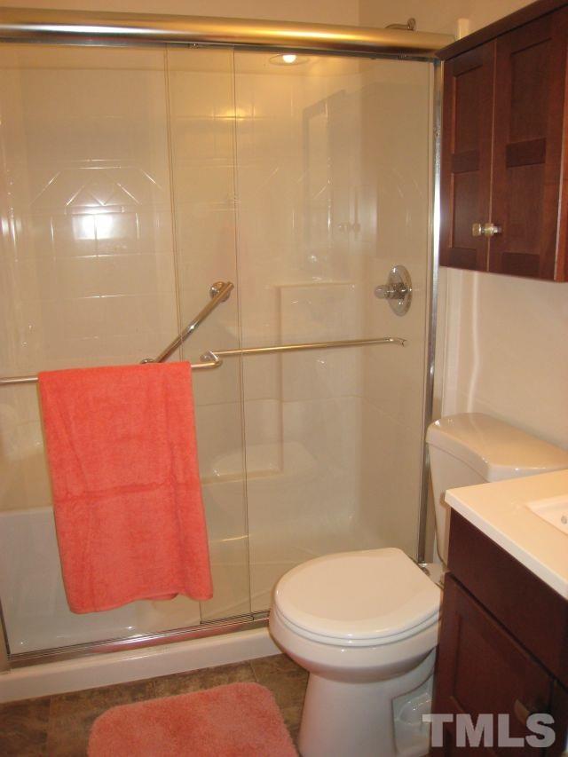 3712 Allen Street West Raleigh, NC 27603 - Photo 10 of 23 a bathroom with a toilet and a shower
