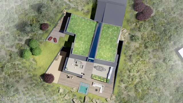 a view of a lush green hillside and houses