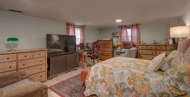 a bedroom with a bed and furniture