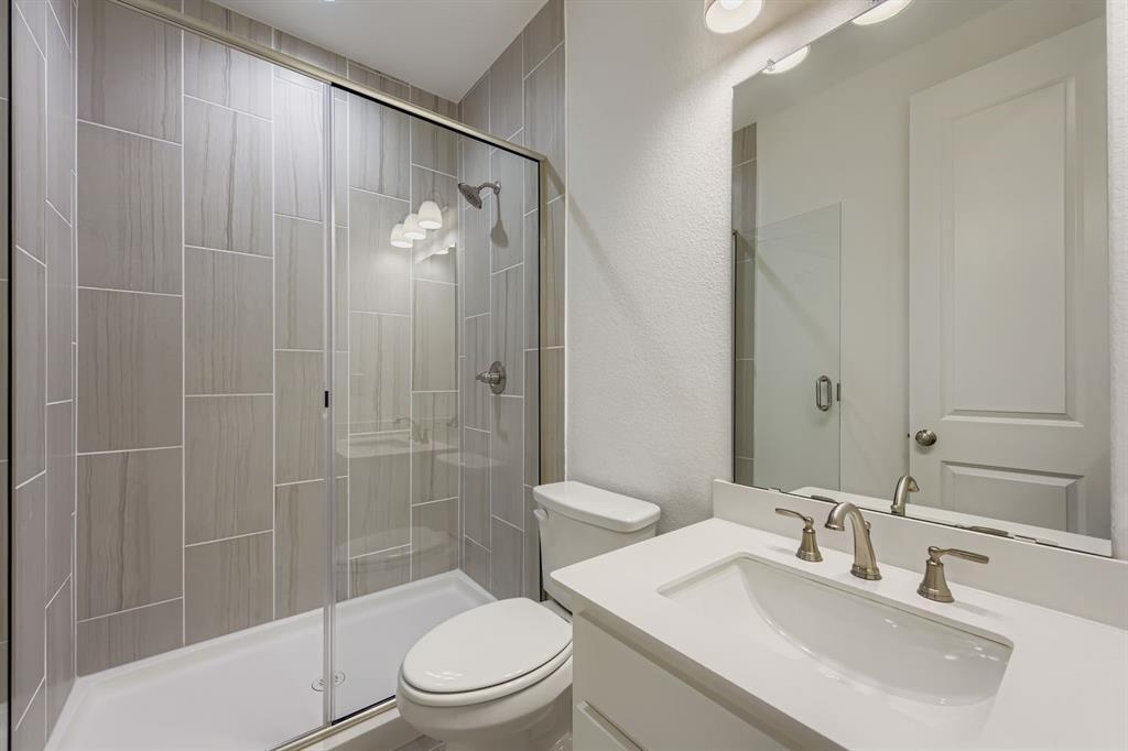 154 Longhorn Bend Rhome, TX 76078 - Photo 20 of 25 a bathroom with a sink a toilet and shower