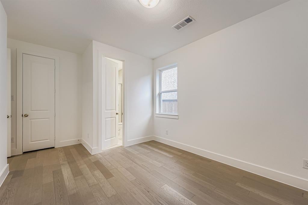 154 Longhorn Bend Rhome, TX 76078 - Photo 22 of 25 a view of a room that has wooden floor and window in it