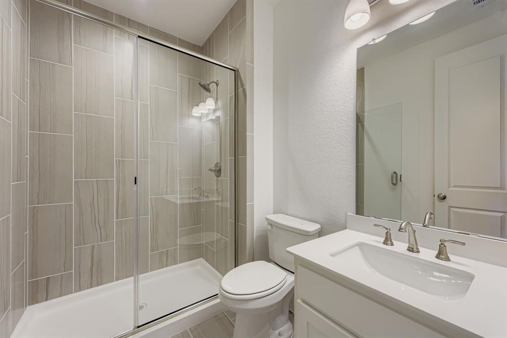 154 Longhorn Bend Rhome, TX 76078 - Photo 23 of 25 a bathroom with a sink toilet and shower