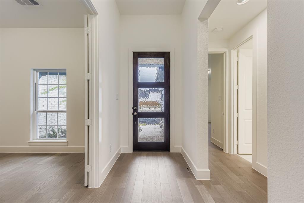 154 Longhorn Bend Rhome, TX 76078 - Photo 3 of 25 a view of entryway with wooden floor