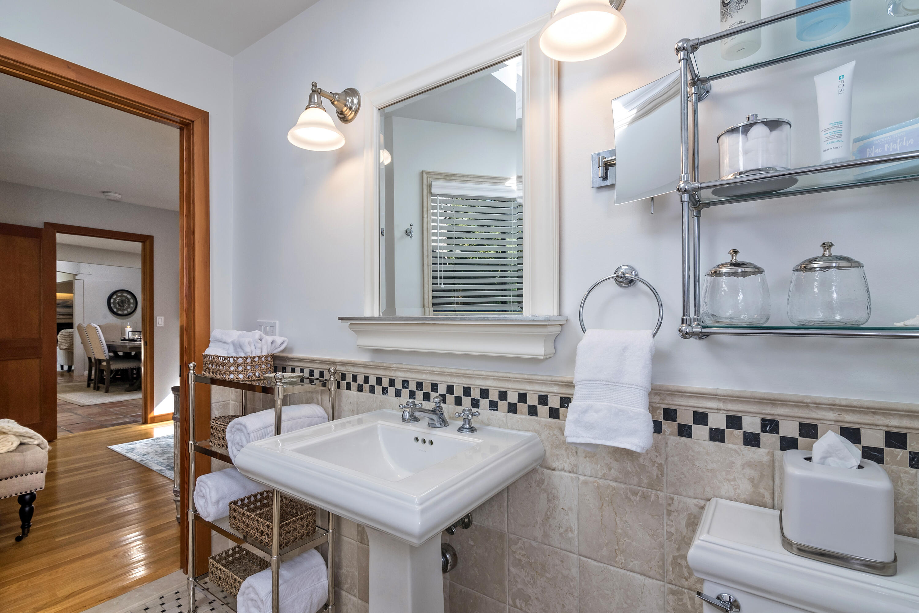 548 San Ysidro Road, Unit 1 Santa Barbara, CA 93108 - Photo 11 of 20 a bathroom with a sink and a mirror