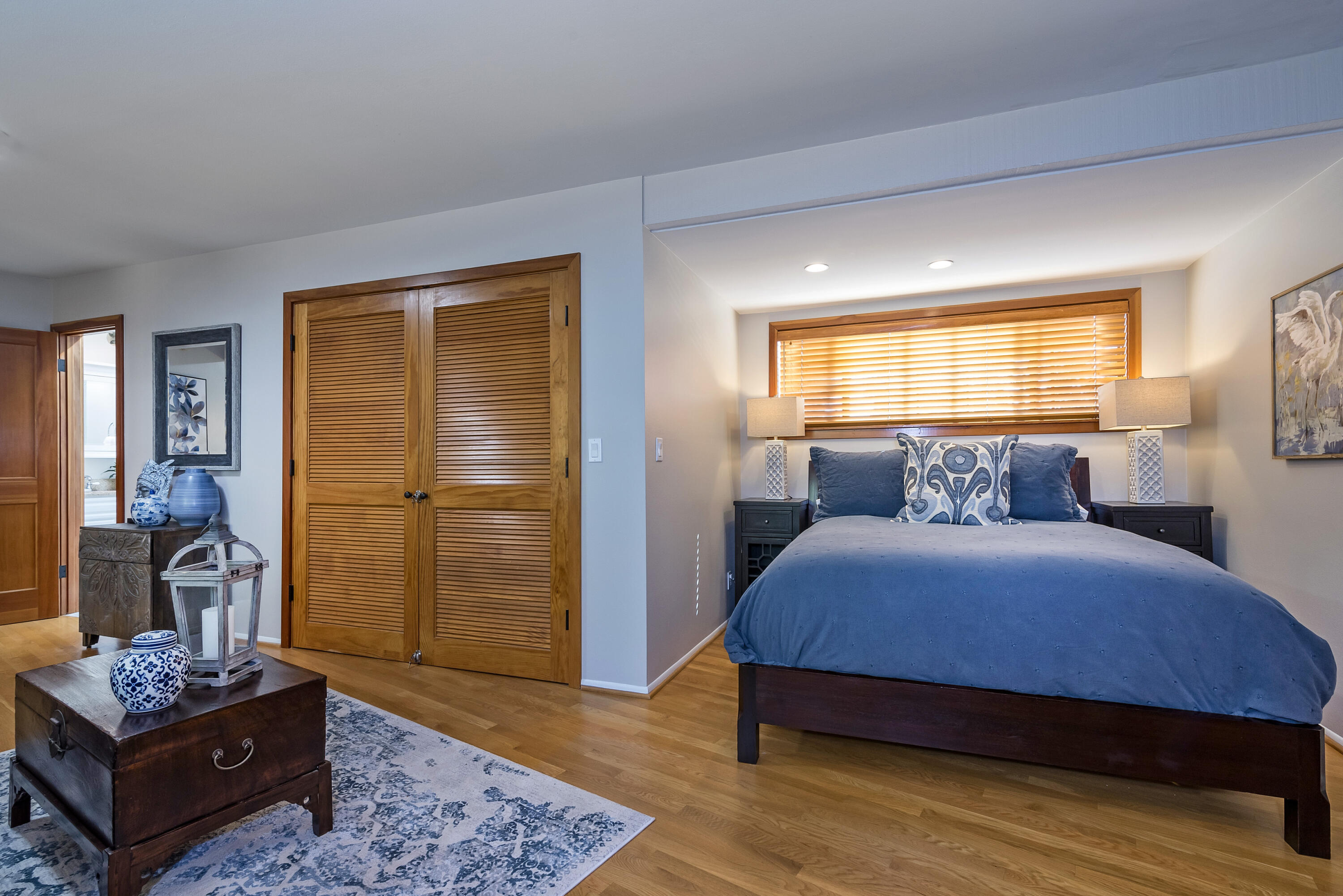 548 San Ysidro Road, Unit 1 Santa Barbara, CA 93108 - Photo 12 of 20 a bedroom with a bed and wooden floor