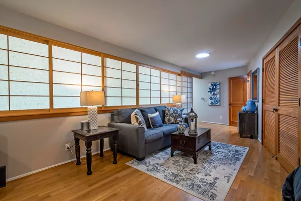 a living room with furniture and a rug