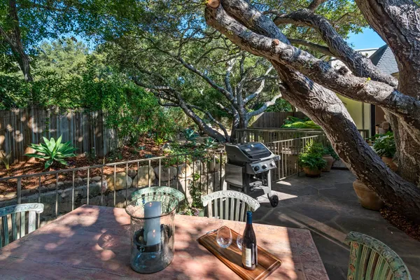 a view of a chairs and table in the balcony