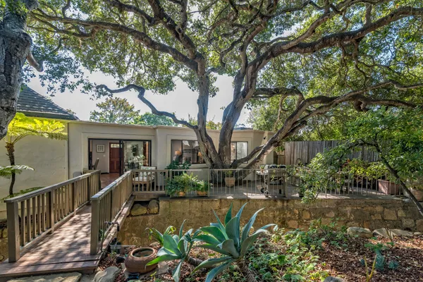a backyard of a house with barbeque oven