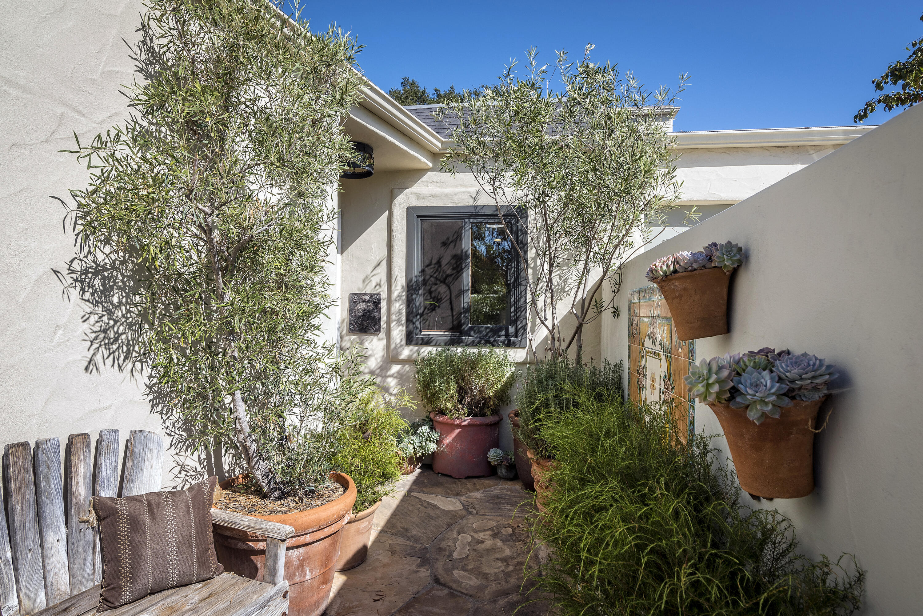 548 San Ysidro Road, Unit 1 Santa Barbara, CA 93108 - Photo 2 of 20 a front view of a house with a yard