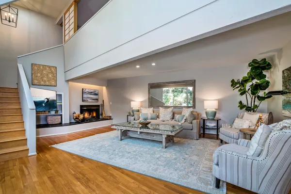a living room with furniture and a flat screen tv