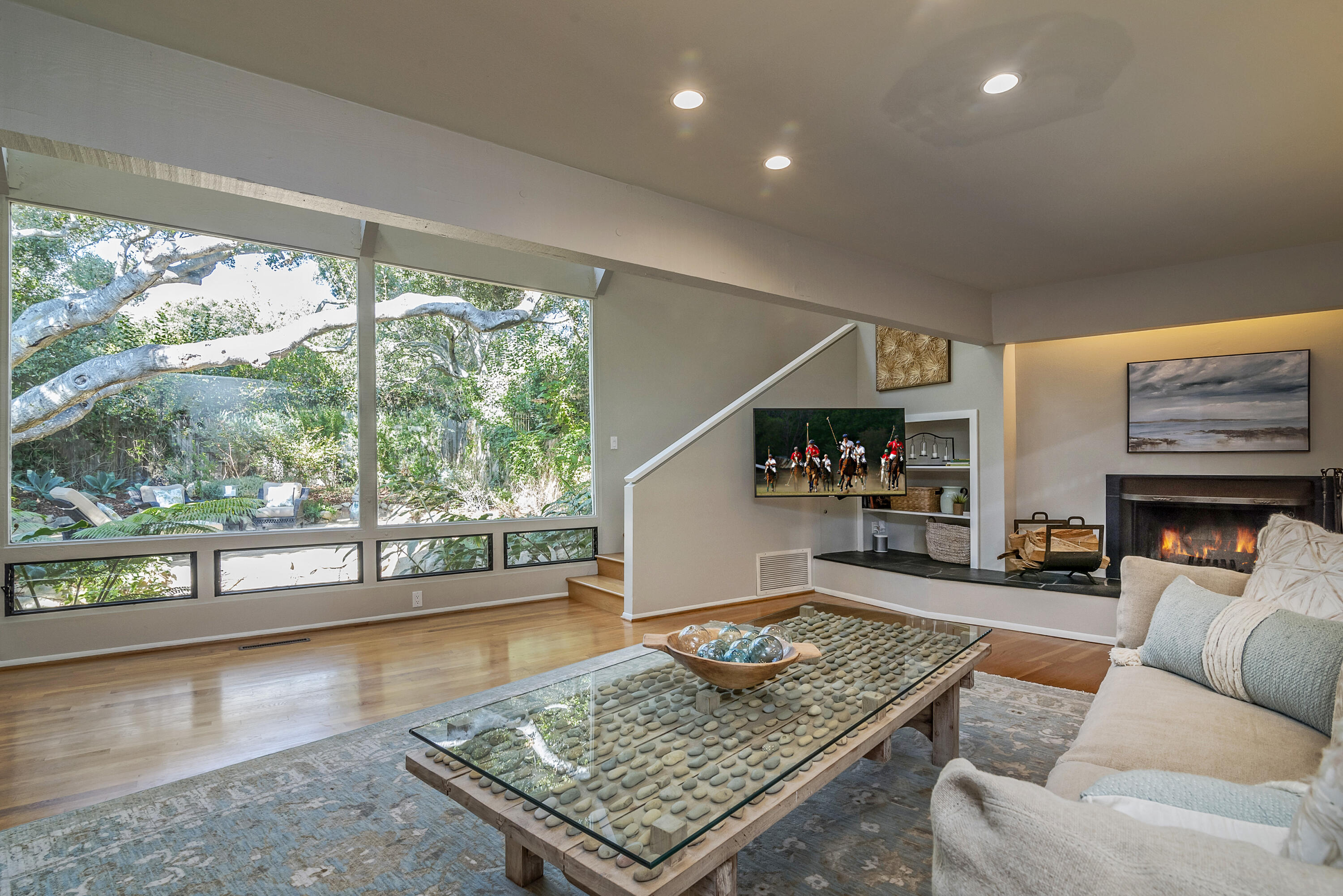 548 San Ysidro Road, Unit 1 Santa Barbara, CA 93108 - Photo 4 of 20 a living room with fireplace furniture and a large window