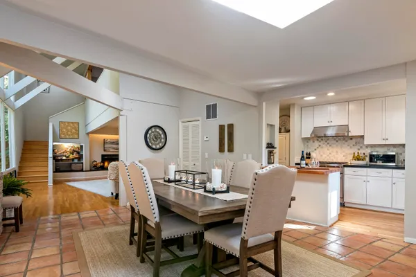 a view of a dining room with furniture and a large window