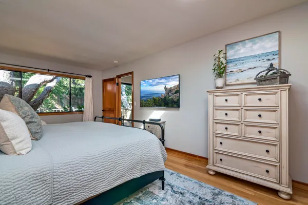 a bedroom with a bed and furniture