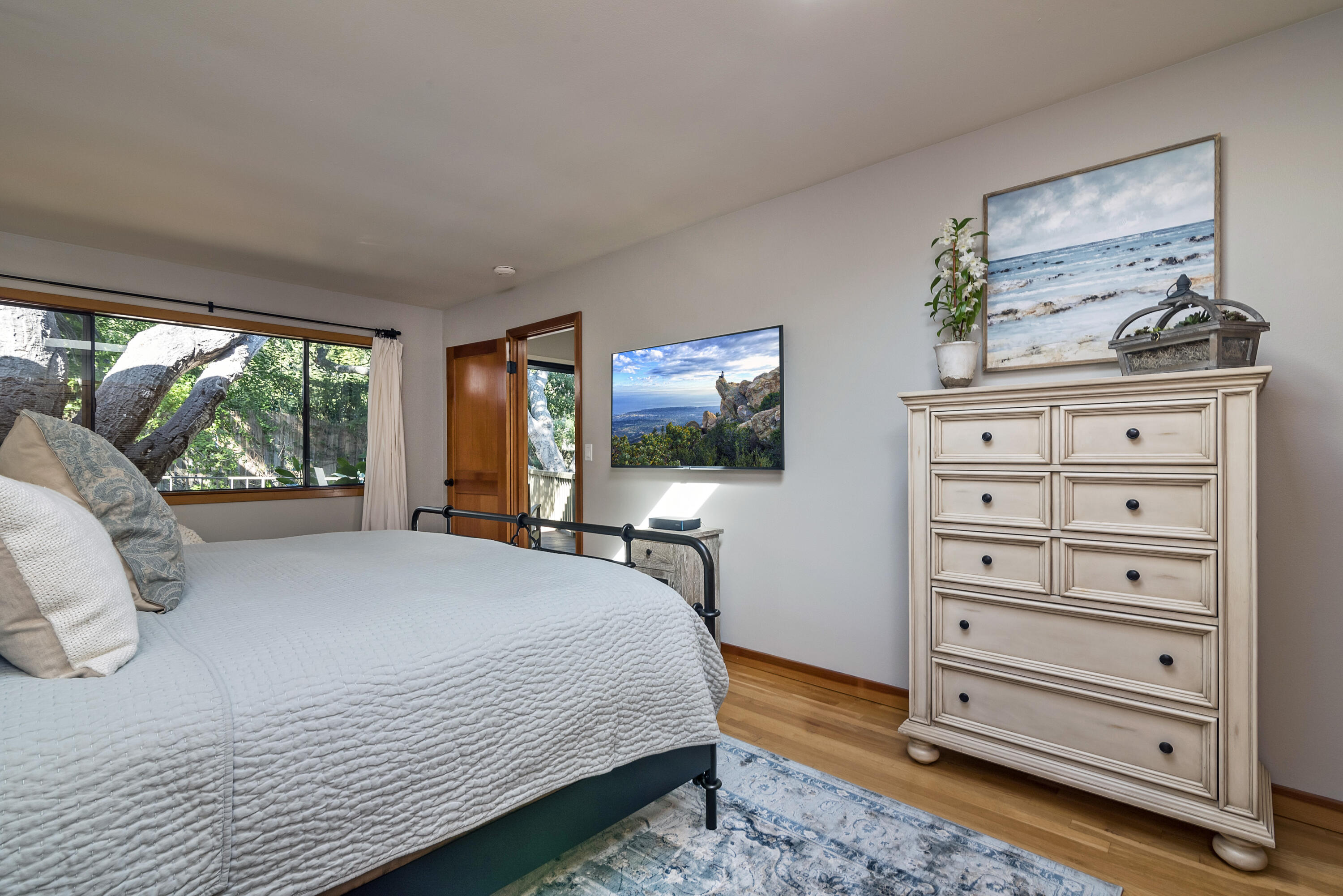 548 San Ysidro Road, Unit 1 Santa Barbara, CA 93108 - Photo 9 of 20 a bedroom with a bed and furniture