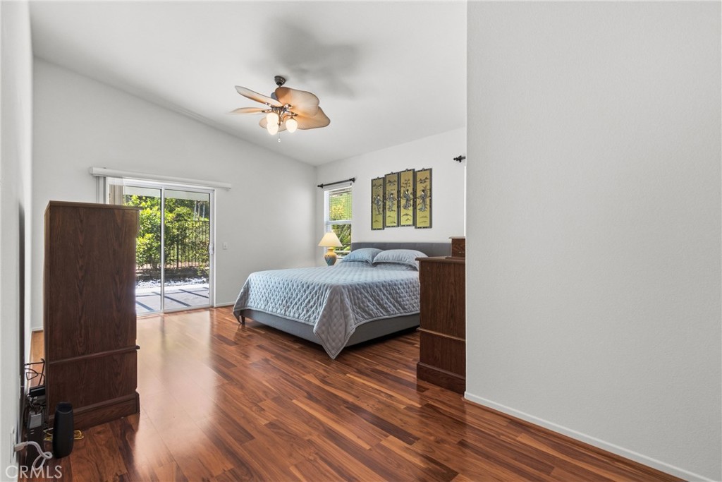 33145 Vermont Road Temecula, CA 92592 - Photo 20 of 41 a bedroom with a bed and wooden floor
