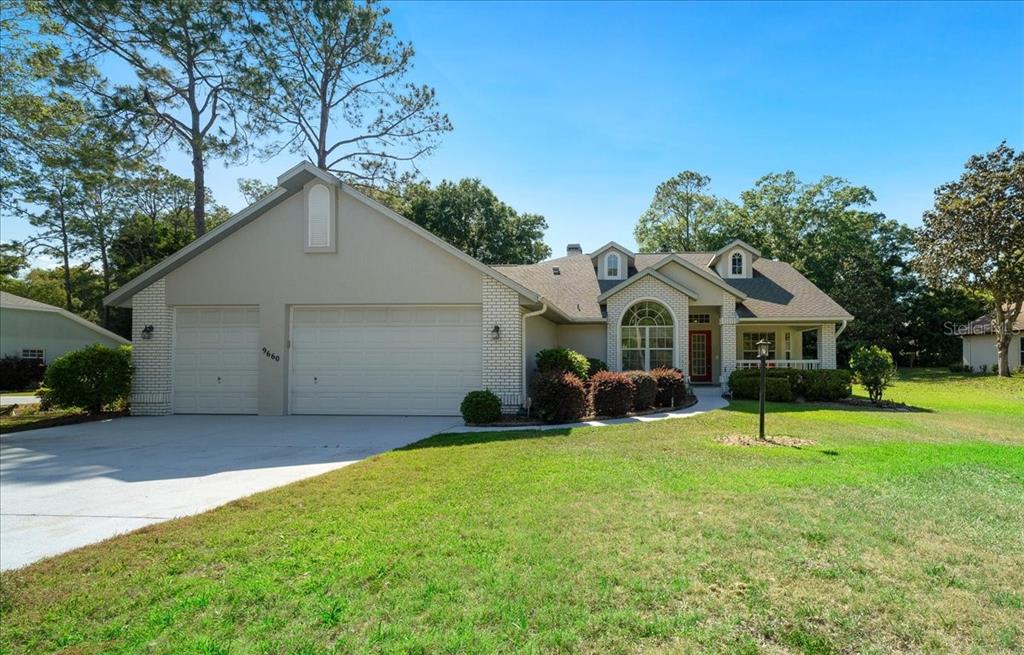 9660 Southwest 196th Avenue Road Dunnellon, FL 34432 - Photo 13 of 67 a front view of a house with a yard