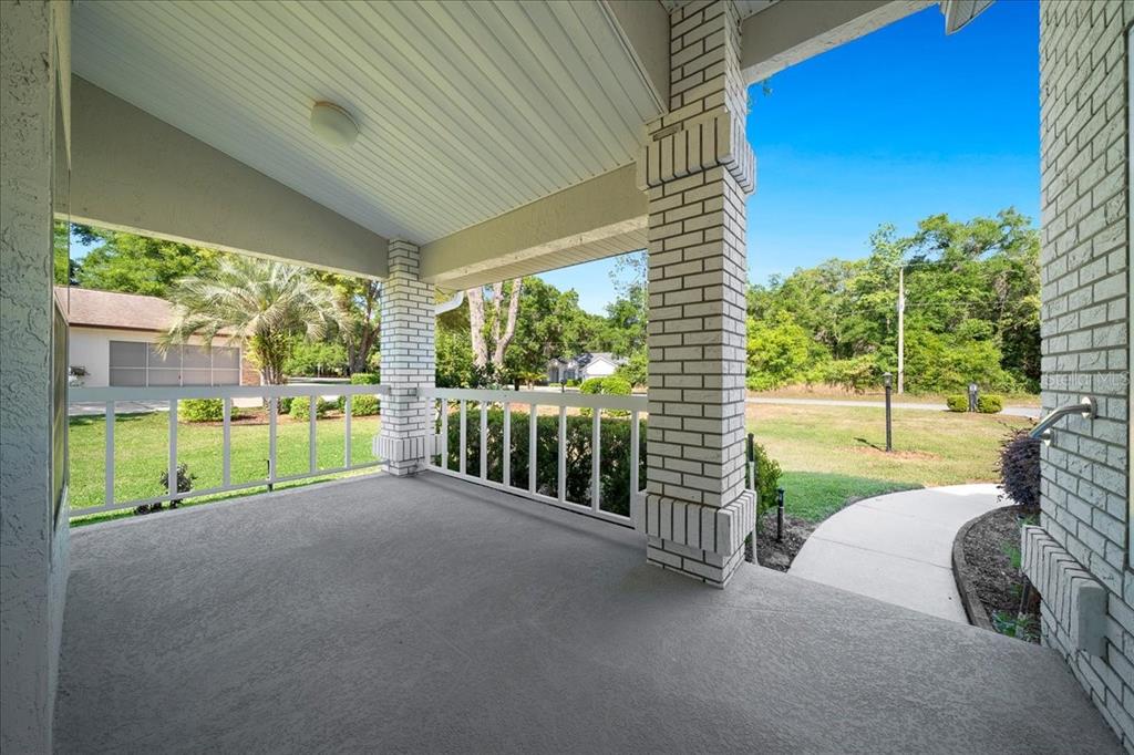 9660 Southwest 196th Avenue Road Dunnellon, FL 34432 - Photo 18 of 67 a view of a garden with porch