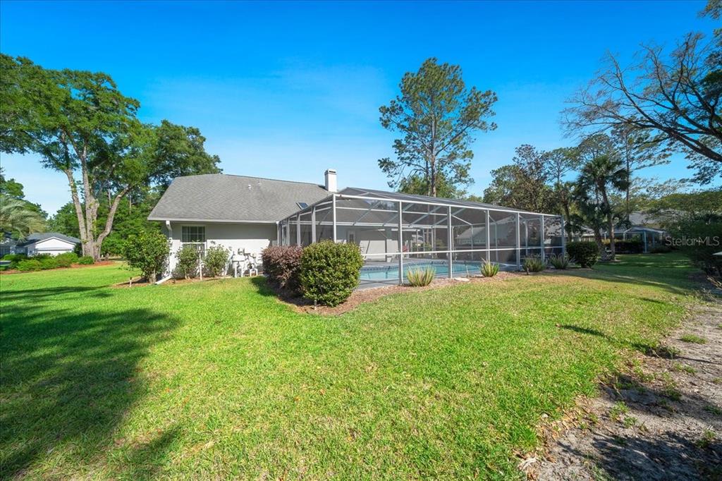 9660 Southwest 196th Avenue Road Dunnellon, FL 34432 - Photo 20 of 67 a view of a house with backyard and sitting area