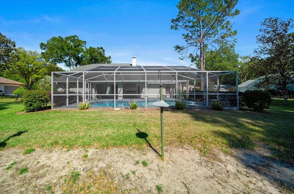 9660 Southwest 196th Avenue Road Dunnellon, FL 34432 - Photo 21 of 67 a view of a house with a yard