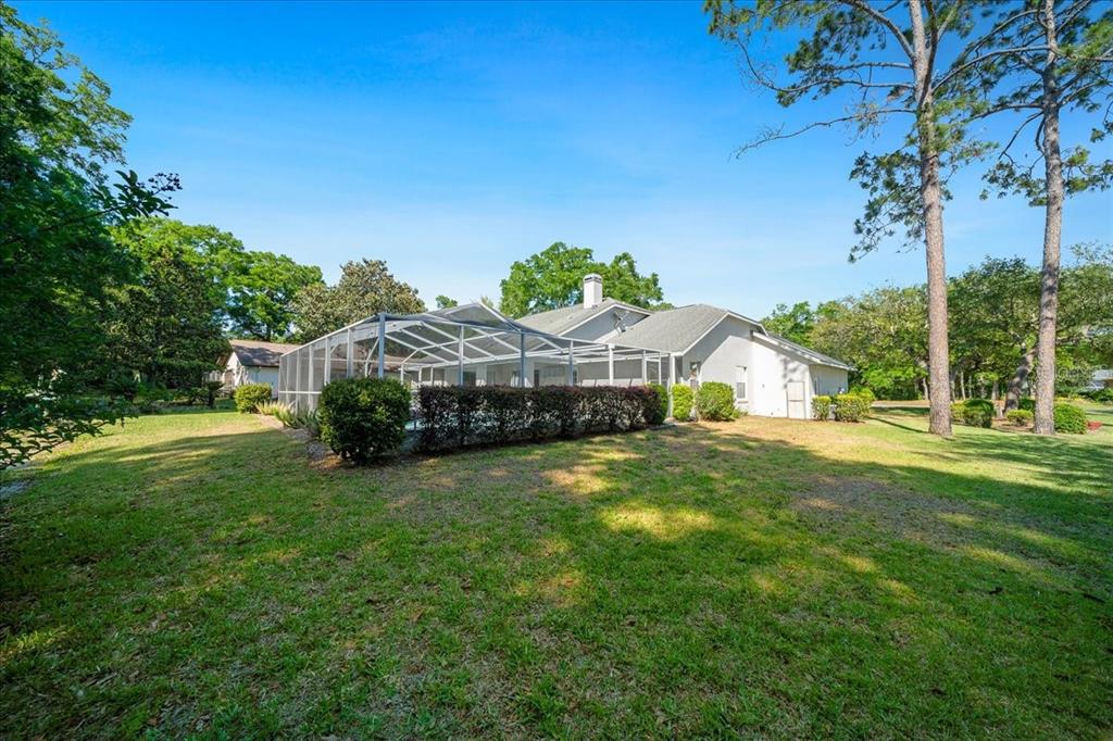 9660 Southwest 196th Avenue Road Dunnellon, FL 34432 - Photo 22 of 67 a view of a house with a backyard