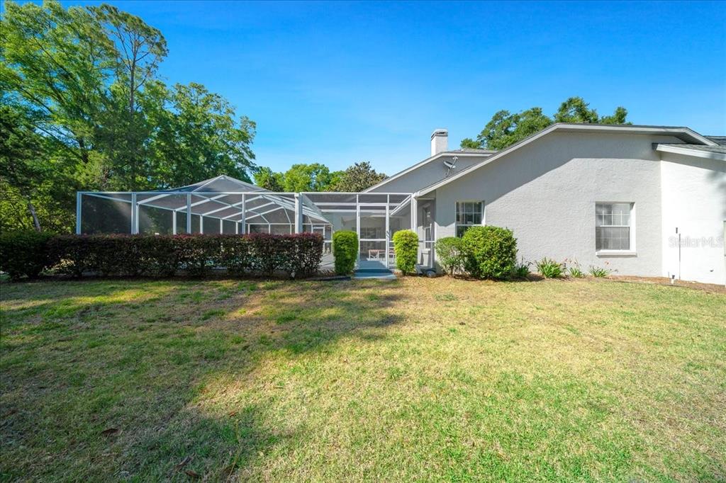 9660 Southwest 196th Avenue Road Dunnellon, FL 34432 - Photo 23 of 67 a front view of a house with a garden