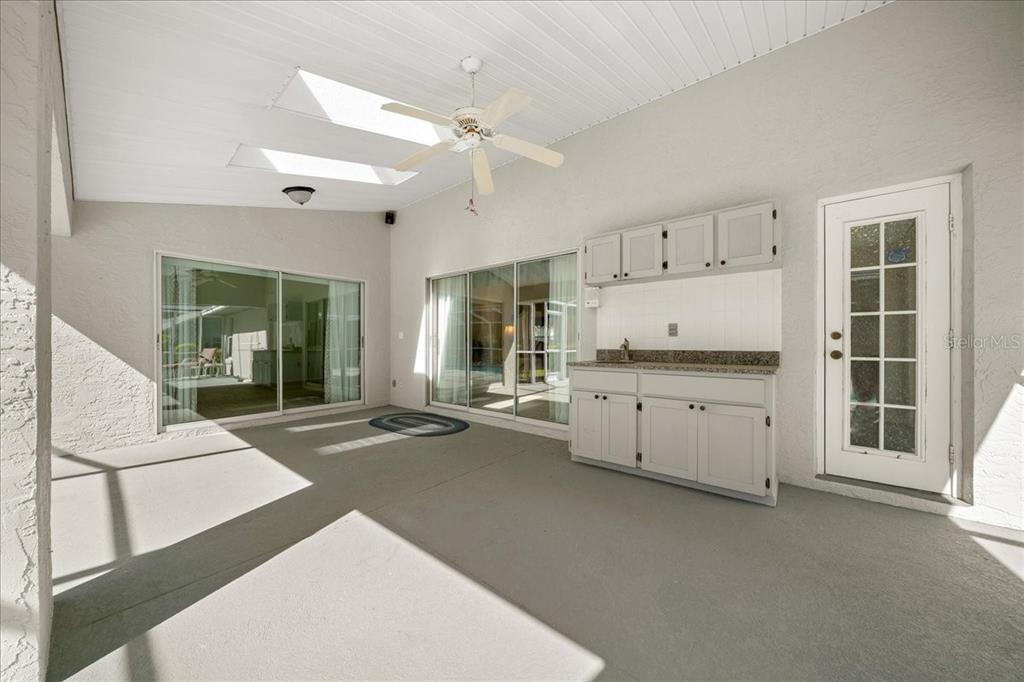 9660 Southwest 196th Avenue Road Dunnellon, FL 34432 - Photo 29 of 67 a living room with furniture and a large window