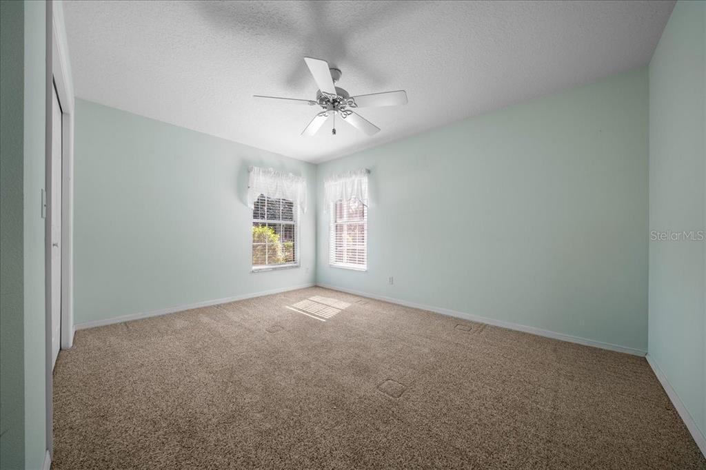9660 Southwest 196th Avenue Road Dunnellon, FL 34432 - Photo 46 of 67 an empty room with windows and fan