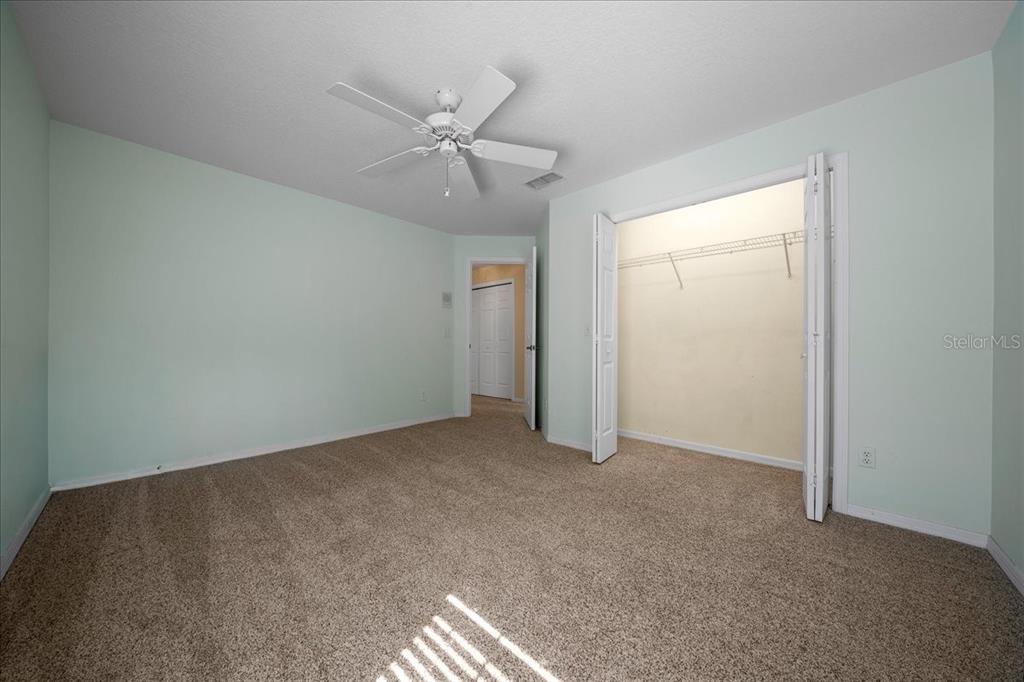 9660 Southwest 196th Avenue Road Dunnellon, FL 34432 - Photo 47 of 67 an empty room with closet and fan