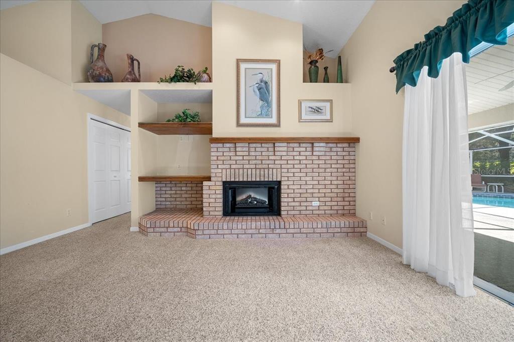 9660 Southwest 196th Avenue Road Dunnellon, FL 34432 - Photo 49 of 67 a view of an empty room with a fireplace and a window