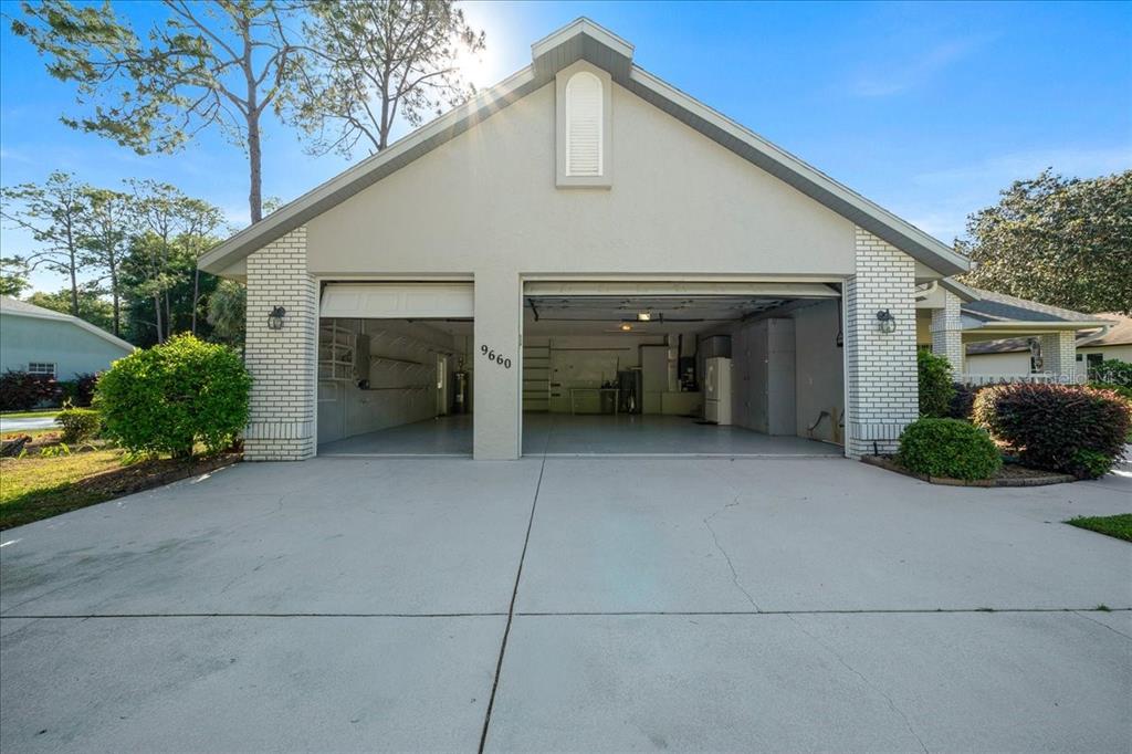 9660 Southwest 196th Avenue Road Dunnellon, FL 34432 - Photo 66 of 67 a view of a house with garage and yard
