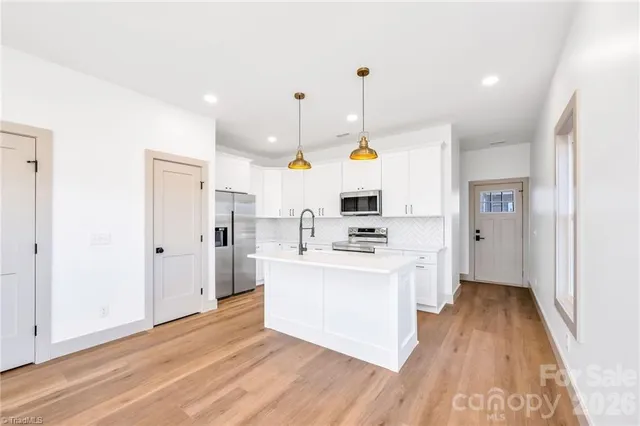 a view of kitchen with wooden floor