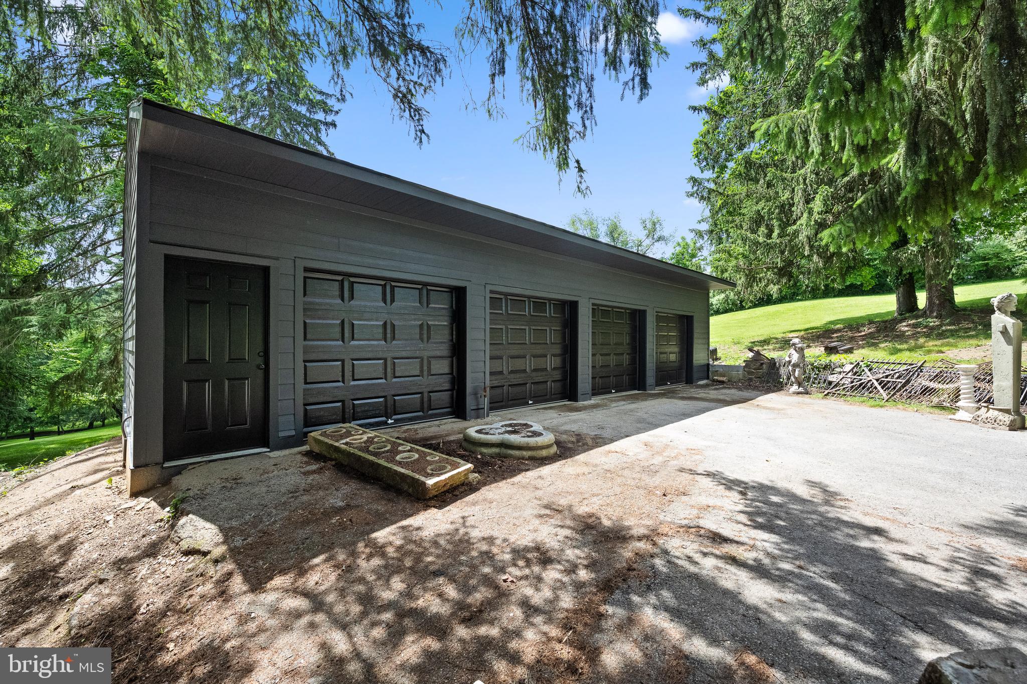 1740 Lenape Road West Chester, PA 19382 - Photo 105 of 120 a front view of a house with a yard and garage