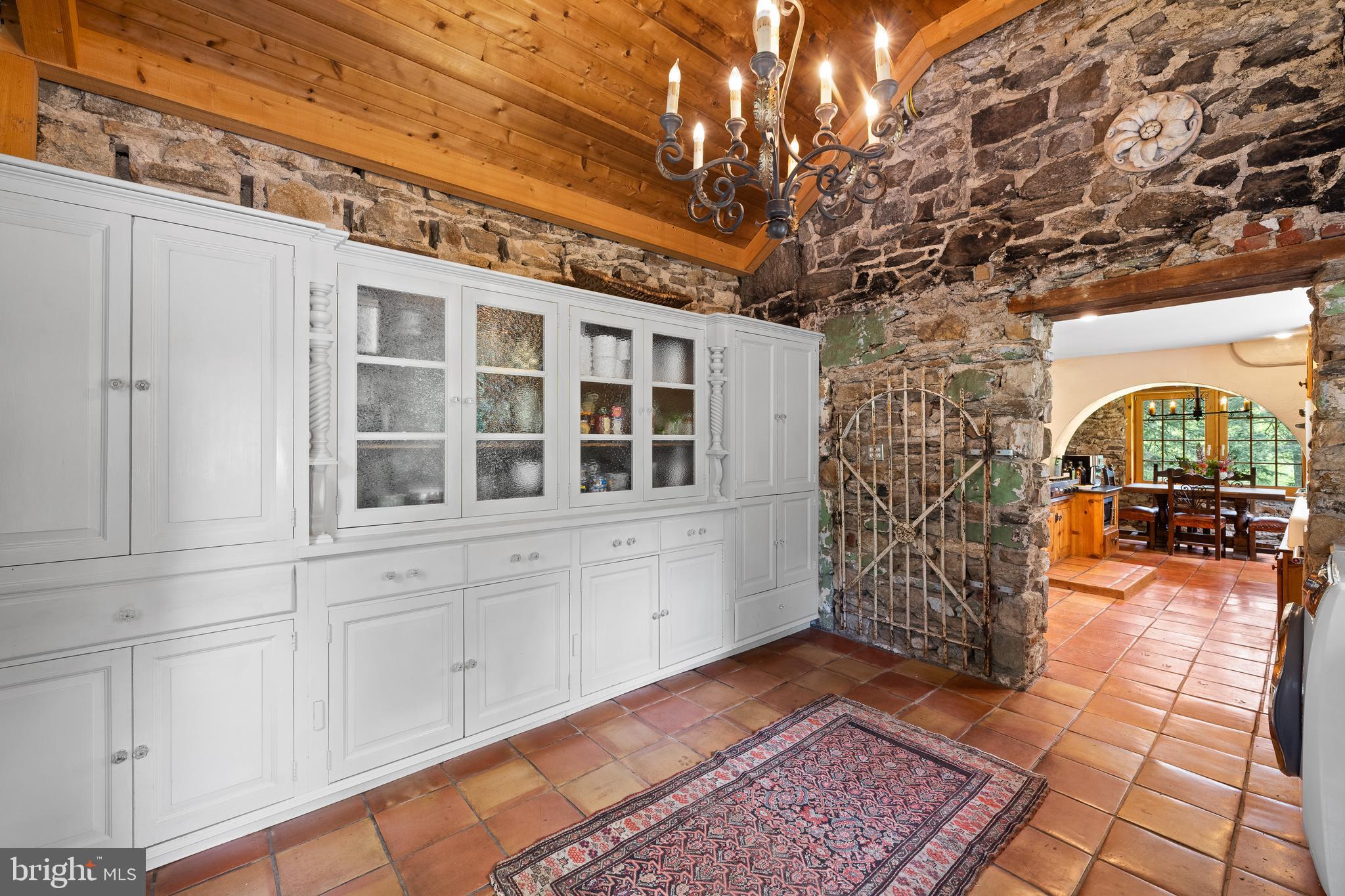 1740 Lenape Road West Chester, PA 19382 - Photo 16 of 120 Entrance to Kitchen with Stonewall & Wood Ceiling
