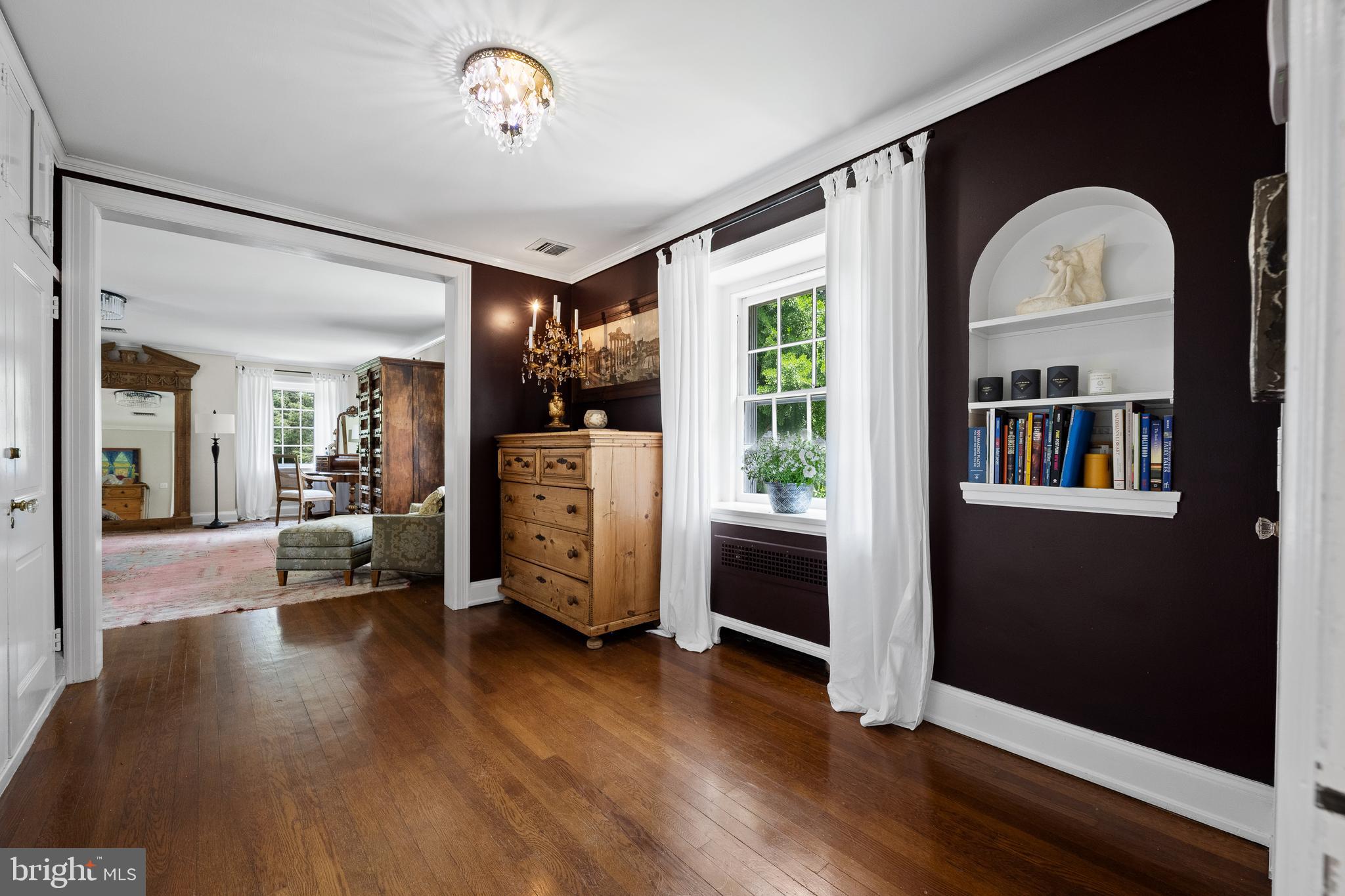 1740 Lenape Road West Chester, PA 19382 - Photo 37 of 120 a view of a livingroom with furniture hardwood floor and a ceiling fan