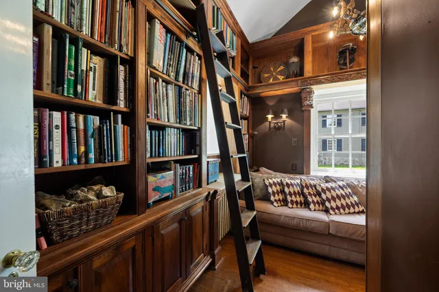 an aerial view of residential houses with outdoor space and trees