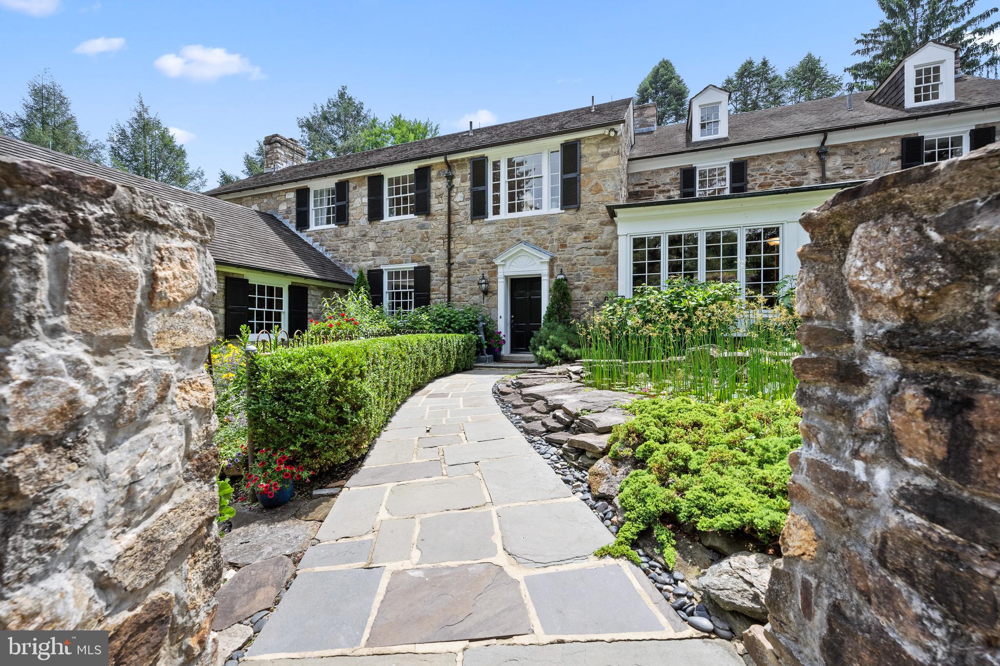 1740 Lenape Road West Chester, PA 19382 - Photo 5 of 120 a front view of a house with garden
