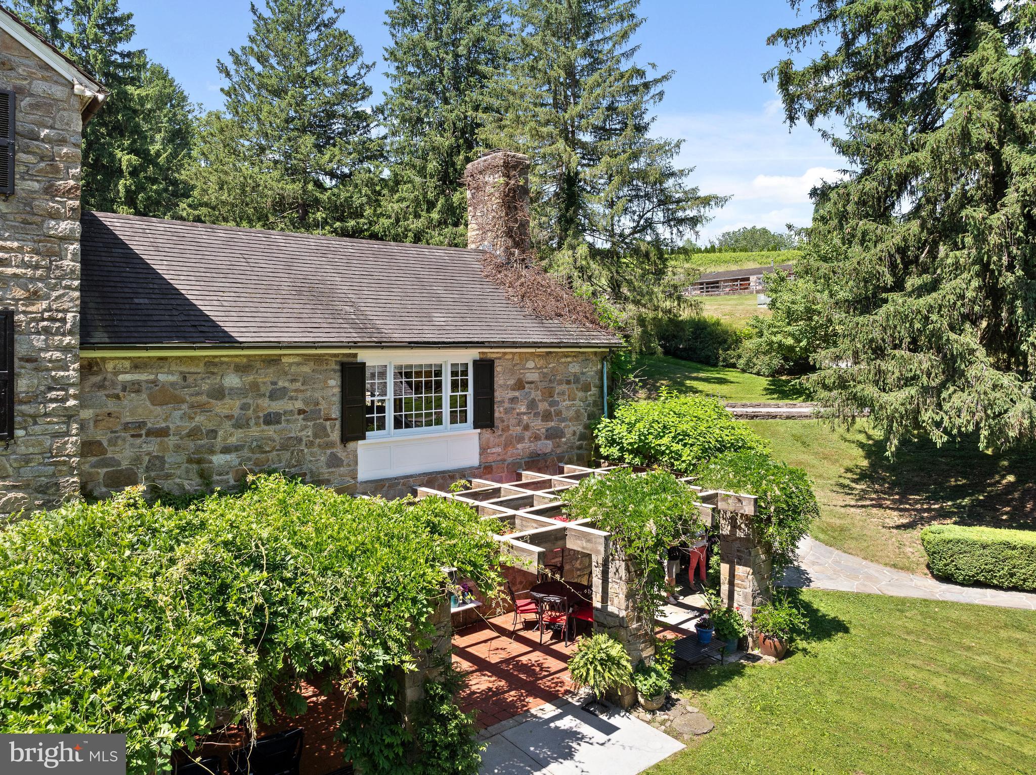 1740 Lenape Road West Chester, PA 19382 - Photo 57 of 120 a aerial view of a house with yard and lake view
