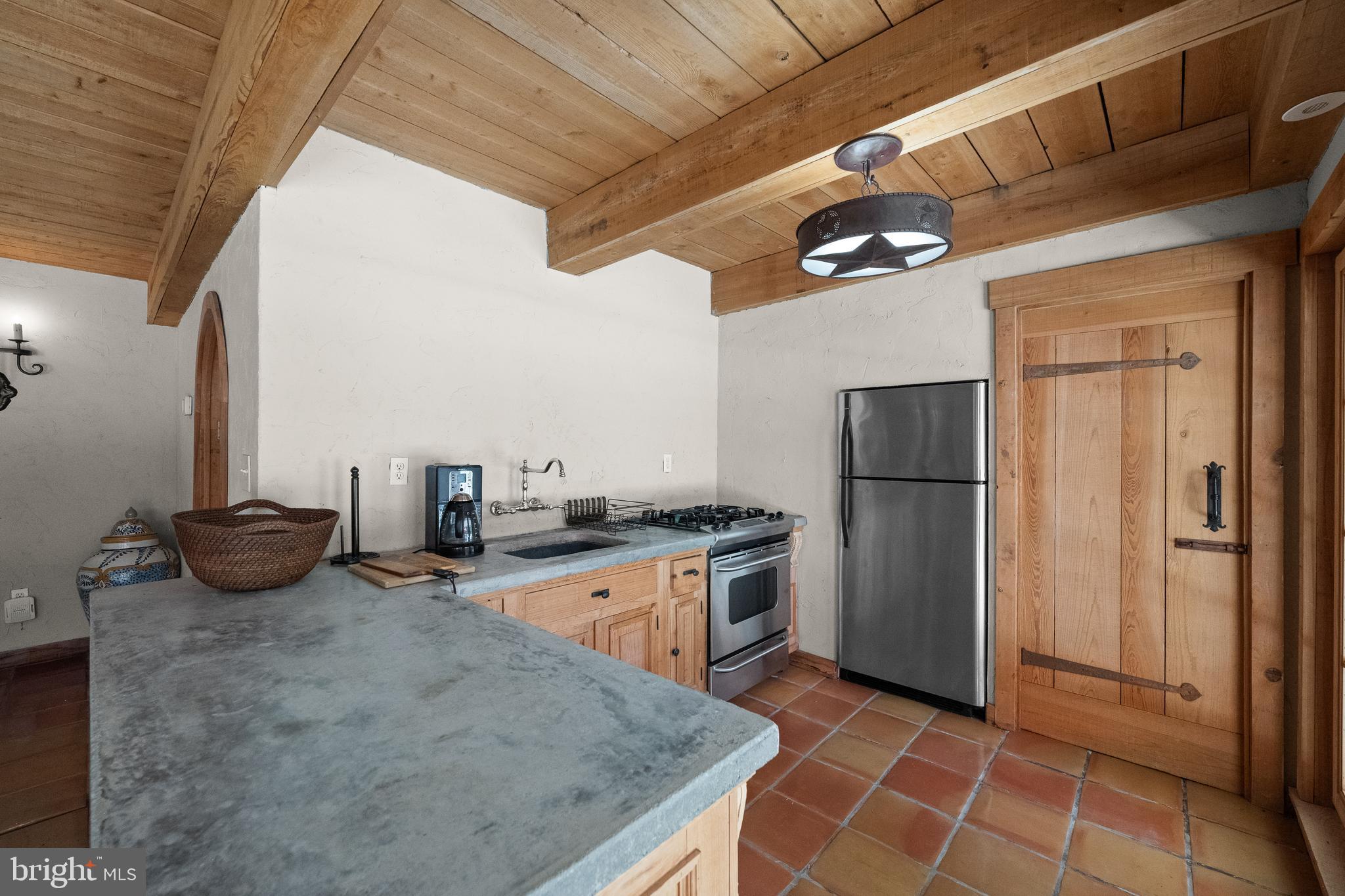 1740 Lenape Road West Chester, PA 19382 - Photo 73 of 120 a kitchen with stainless steel appliances granite countertop a sink a stove a refrigerator cabinets and a dining table