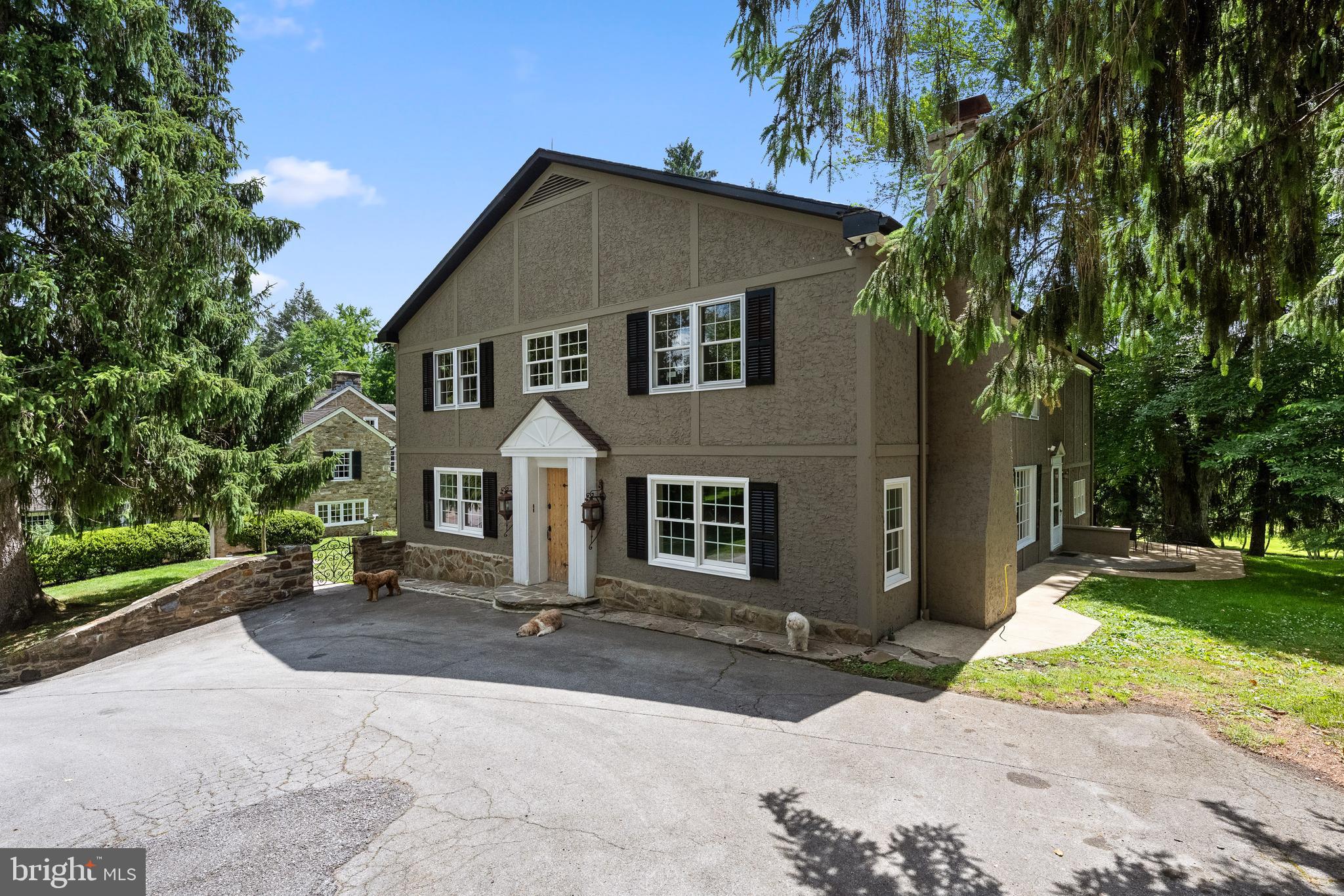 1740 Lenape Road West Chester, PA 19382 - Photo 85 of 120 a front view of a house with a yard and garage