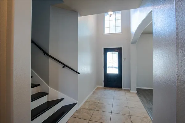 a view of an entryway with wooden floor