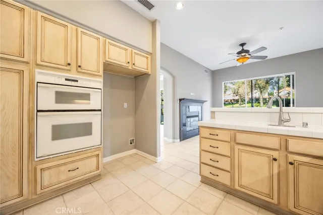 a kitchen with cabinets and appliances