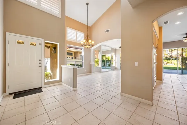 a view of a refrigerator and an empty room
