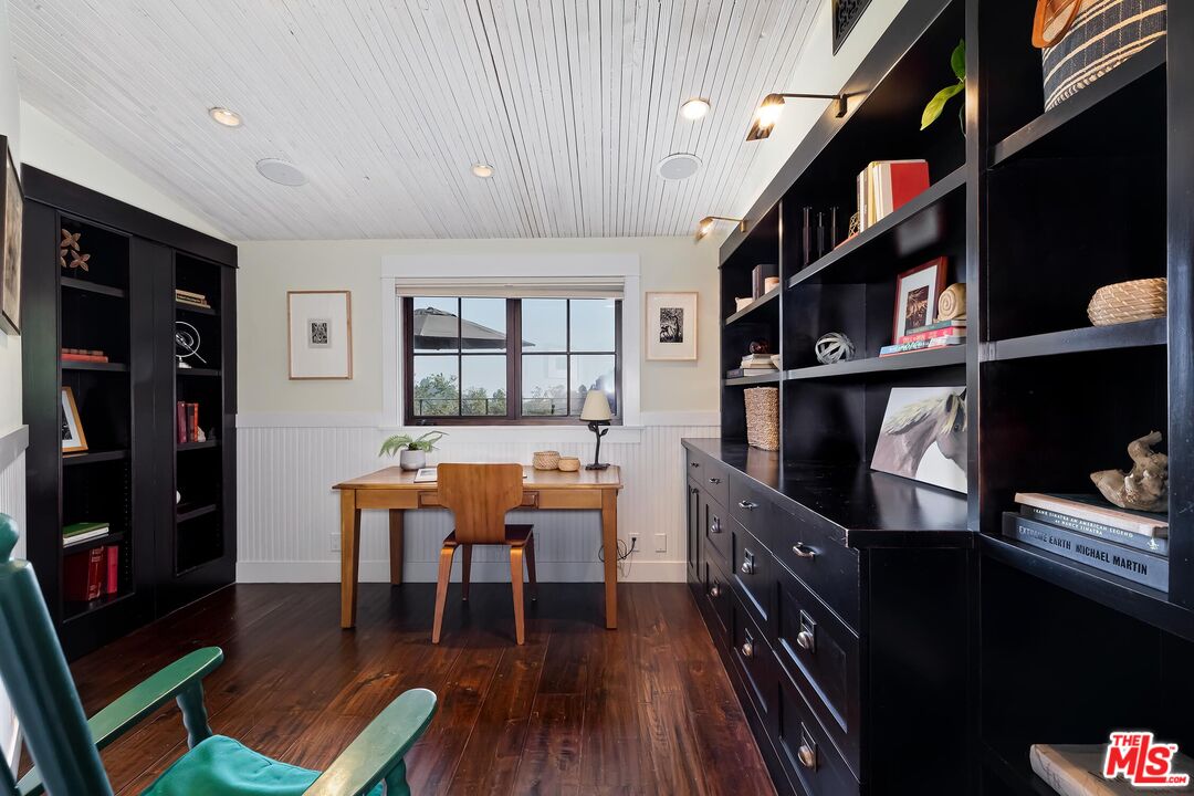 13240 Chalon Road Los Angeles, CA 90049 - Photo 12 of 46 a dining room with wooden floor and furniture