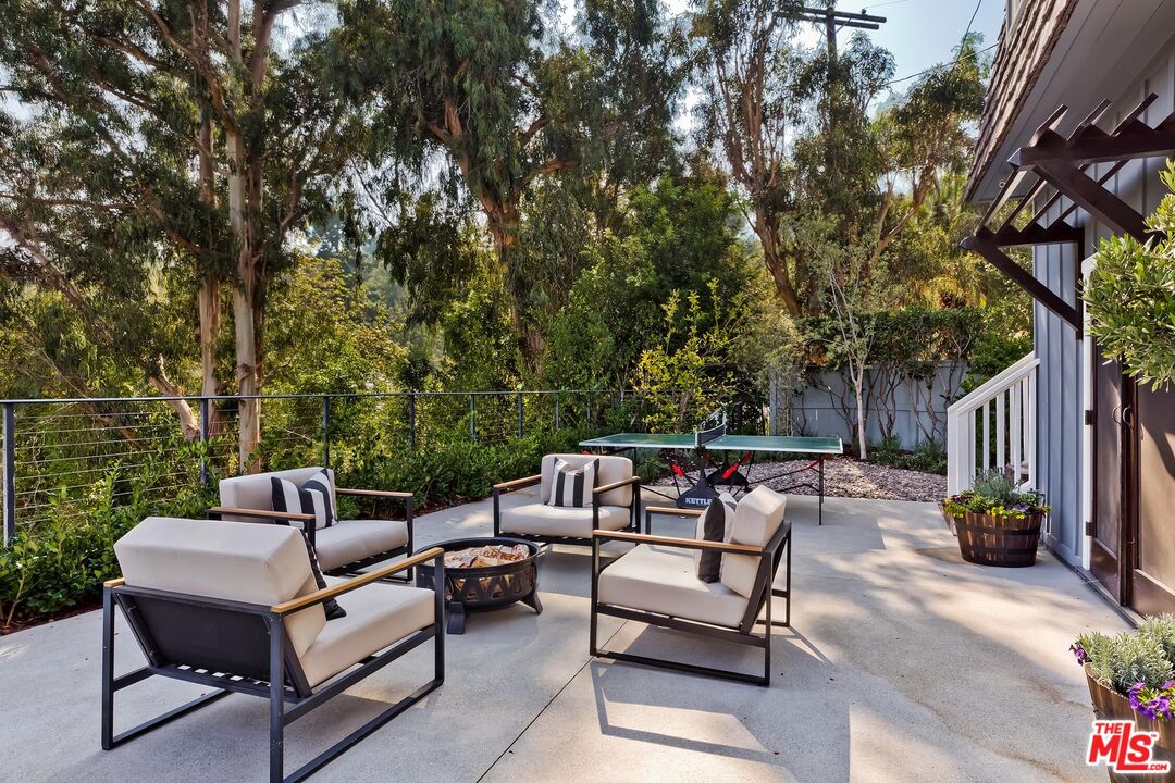 13240 Chalon Road Los Angeles, CA 90049 - Photo 2 of 46 a patio view with a seating space