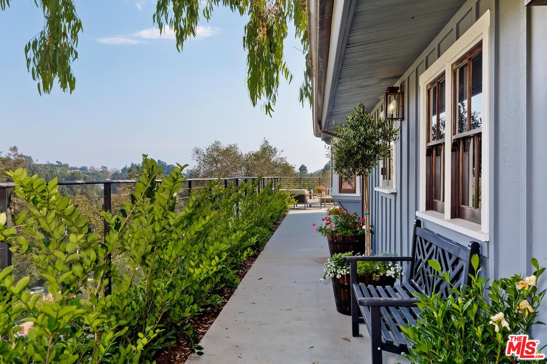 13240 Chalon Road Los Angeles, CA 90049 - Photo 32 of 46 a view of a backyard with plants