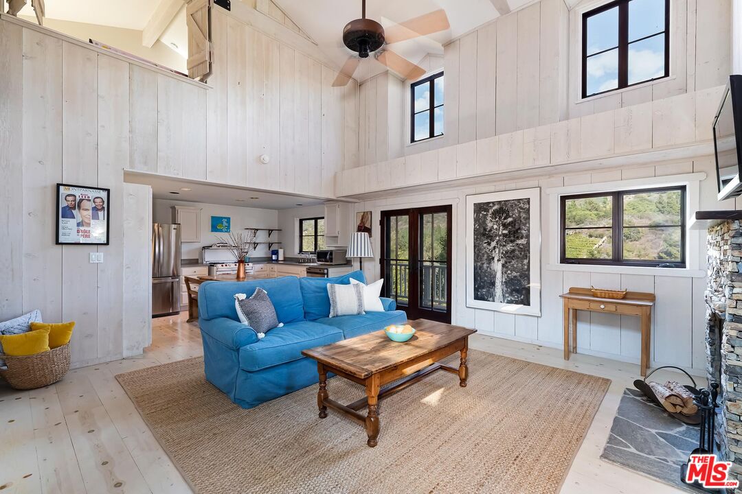 13240 Chalon Road Los Angeles, CA 90049 - Photo 33 of 46 a living room with furniture and a fireplace